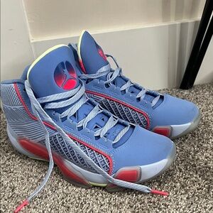 Jordan Blue High-Top Sneakers with Red Accents